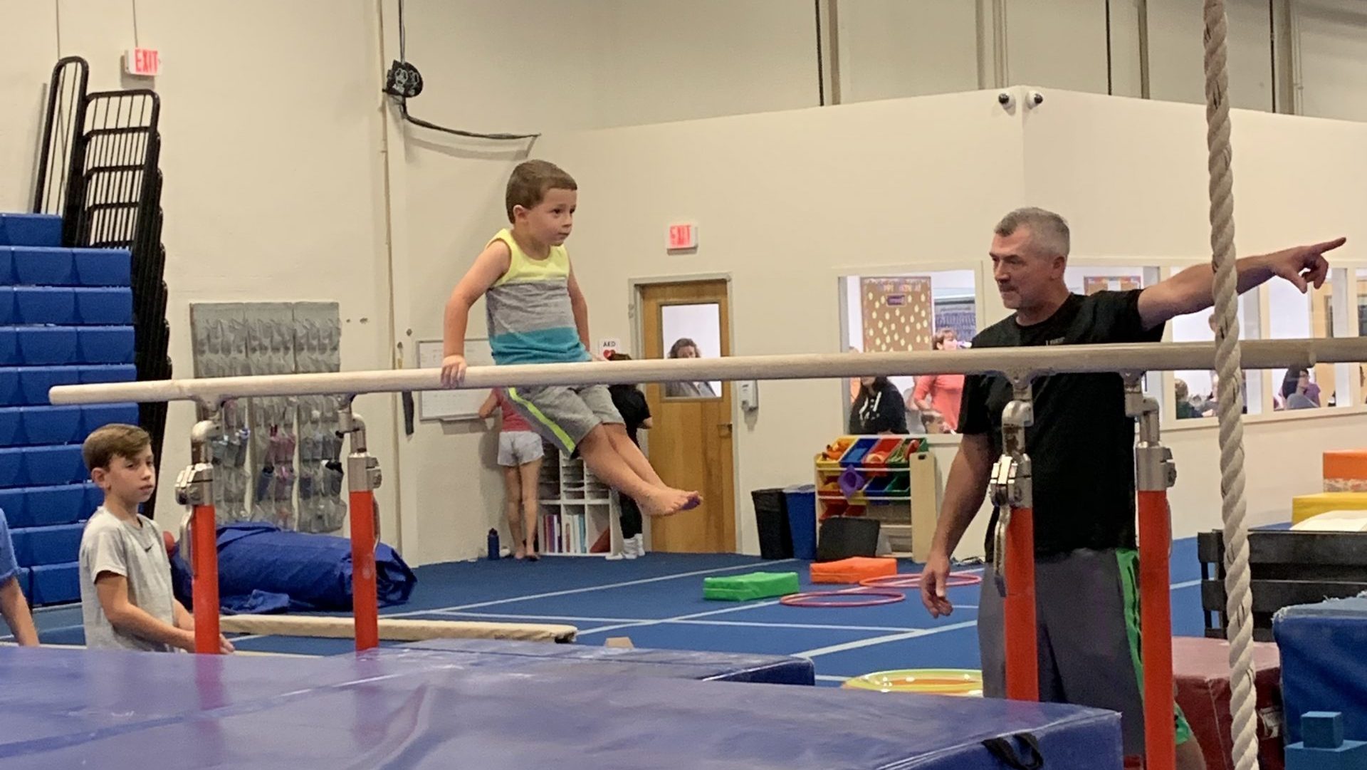 Boy on bar at Legends Gymnastics in North Andover, MA.